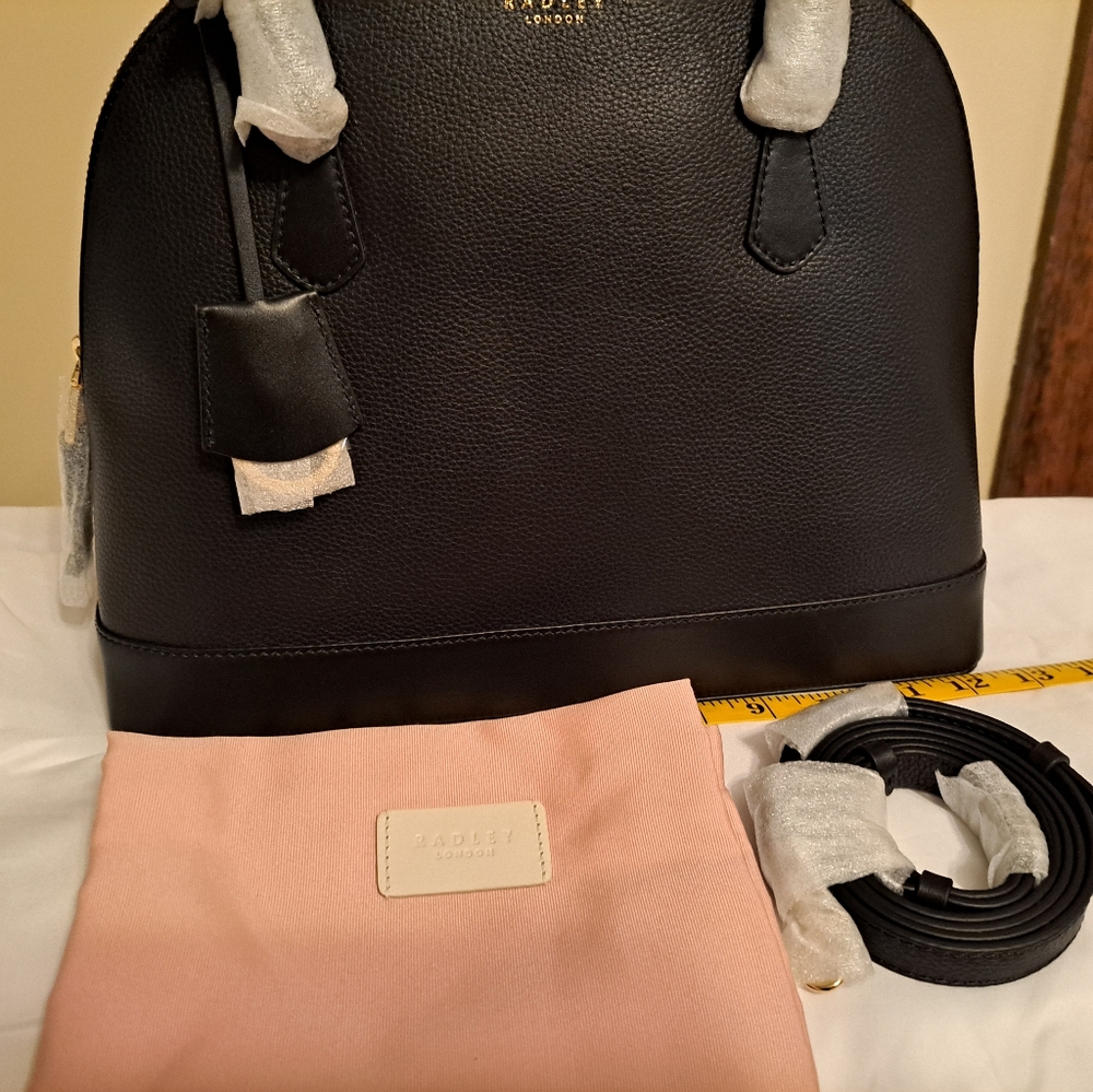 Radley London black leather bag with crossbody strap and dust bag.